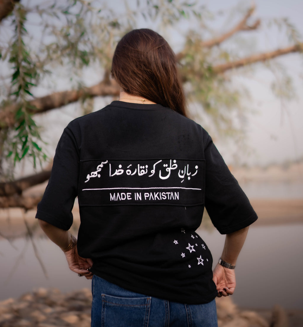 TAAB Statement black oversized t-shirt with Urdu print, model photo 2
