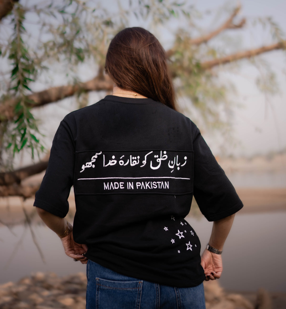 TAAB Statement black oversized t-shirt with Urdu print, model photo 2
